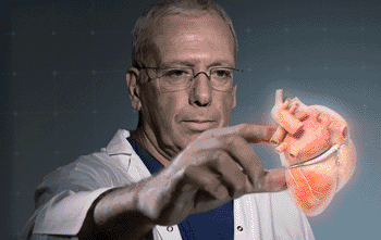 Image: Manipulating a 3D hologram (see video) (Photo courtesy of RealView Imaging).